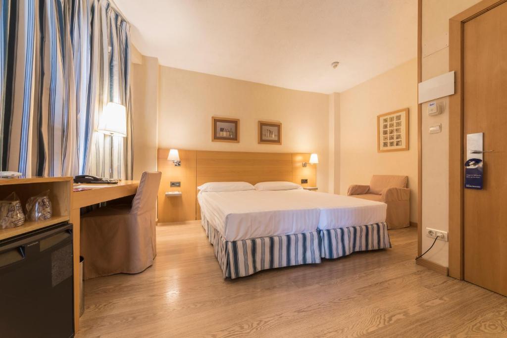 A bed or beds in a room at Infanta Mercedes