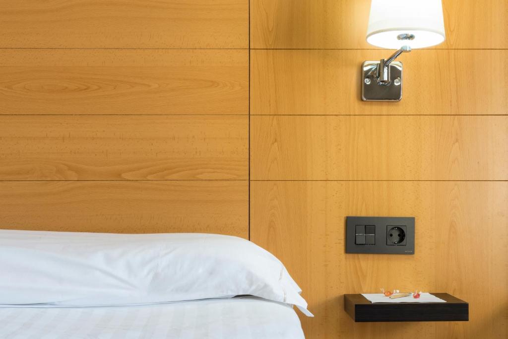 A bed or beds in a room at Infanta Mercedes