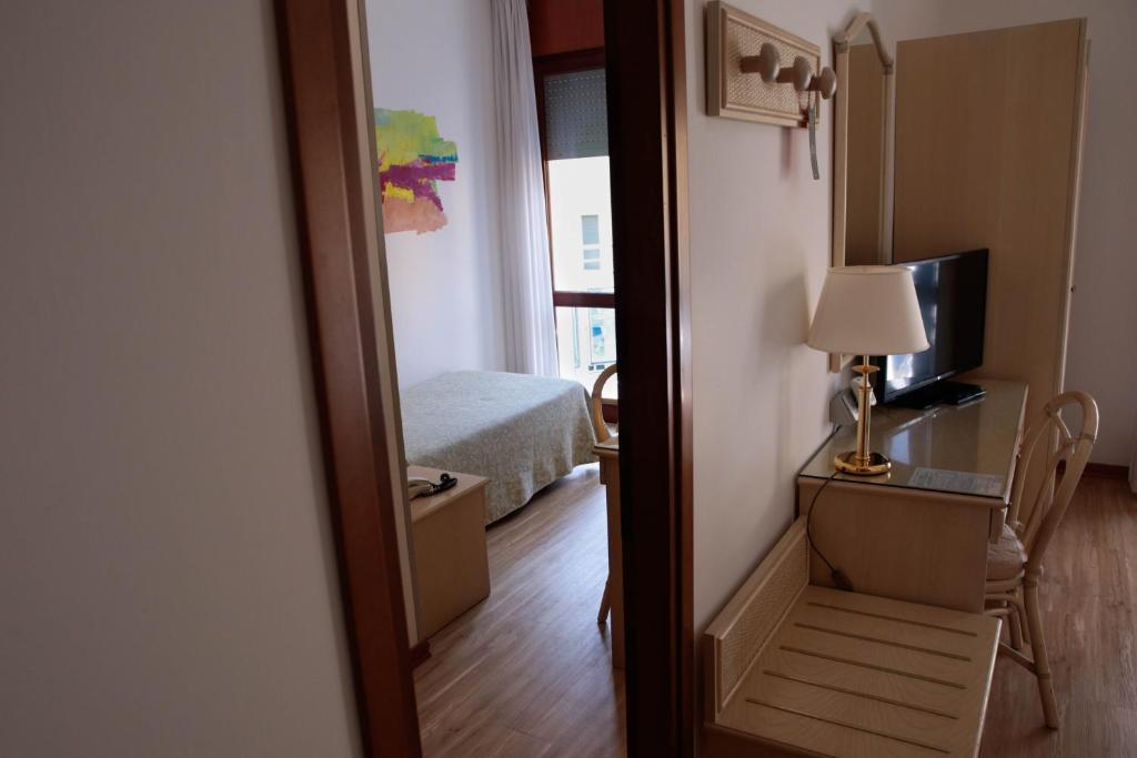 Ein Bett oder Betten in einem Zimmer der Unterkunft Hotel Croce Di Malta