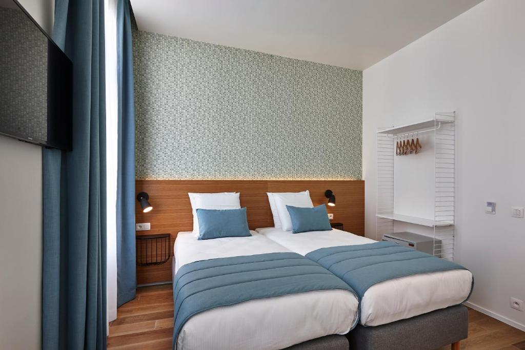 Postel nebo postele na pokoji v ubytování Hygge Hotel