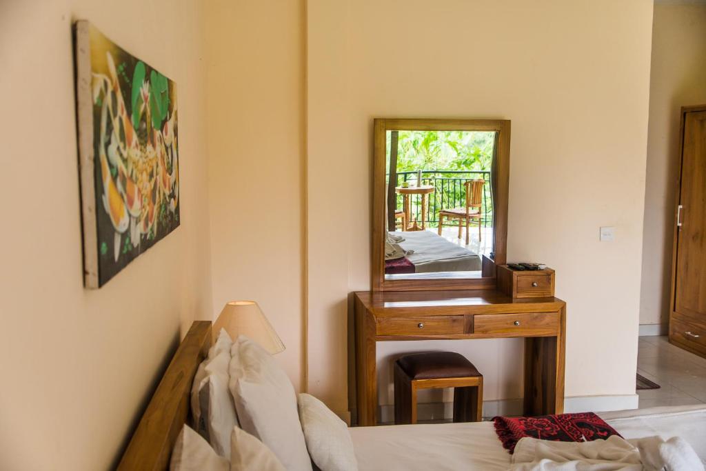 Postel nebo postele na pokoji v ubytování Pondok Bali