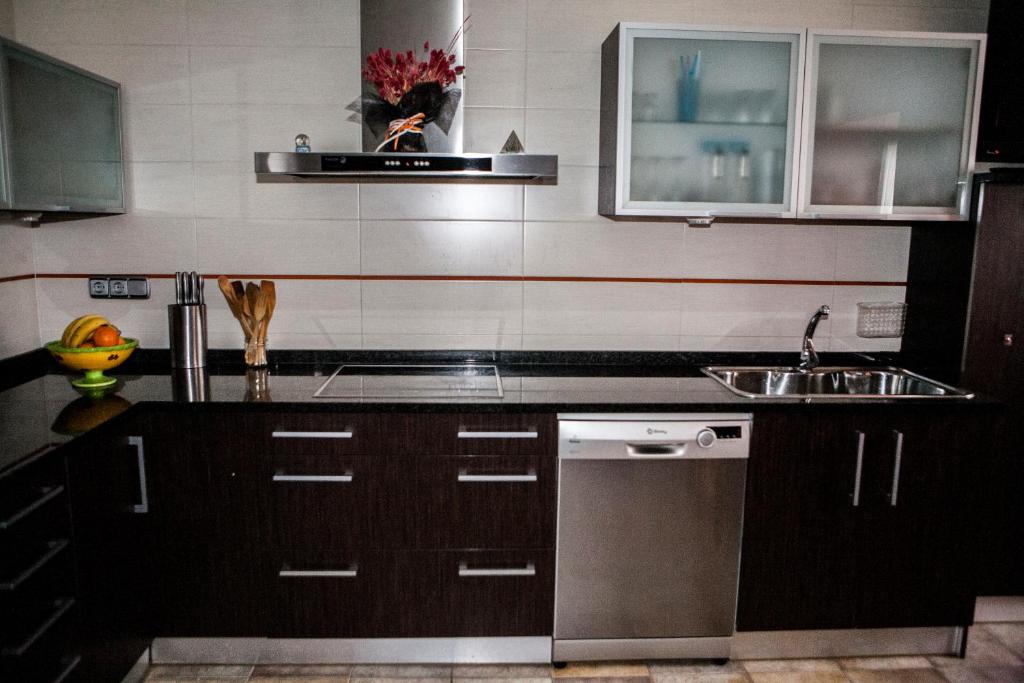 a kitchen with a sink and a dishwasher at Casa Rural Tolareta in Arantza