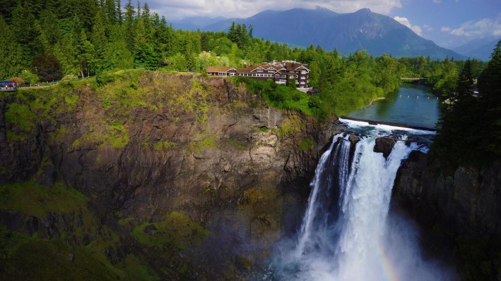 a house on top of a waterfall on a mountain at Salish Lodge & Spa in Snoqualmie
