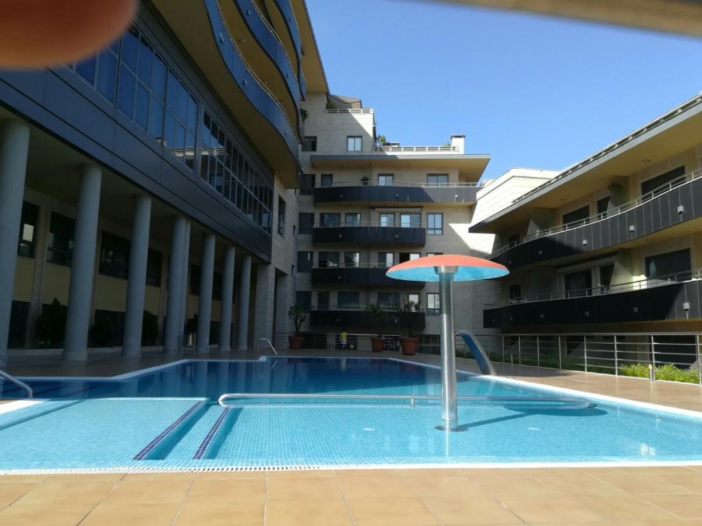 Bazén v ubytovaní Apartamento Playa Silgar alebo v jeho blízkosti