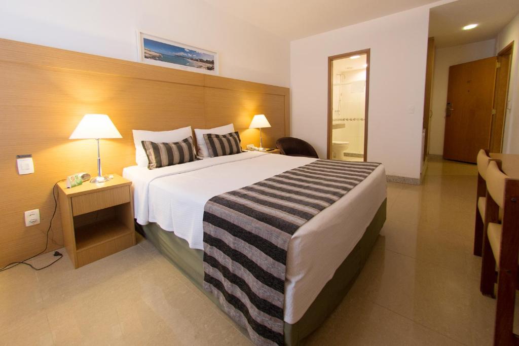 Una cama o camas en una habitación de Real Palace Hotel