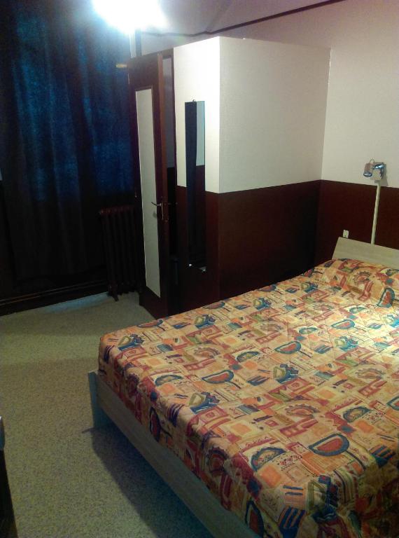 Postel nebo postele na pokoji v ubytování Hotel le Rallye