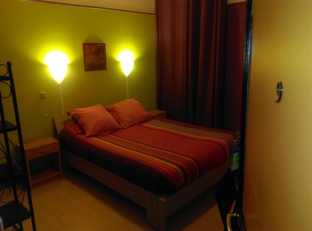 Postel nebo postele na pokoji v ubytování Hotel le Rallye