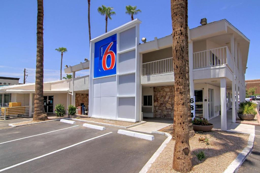 a large white building with a sign on the side of it at Motel 6 Old town Scottsdale Fashion Square in Scottsdale