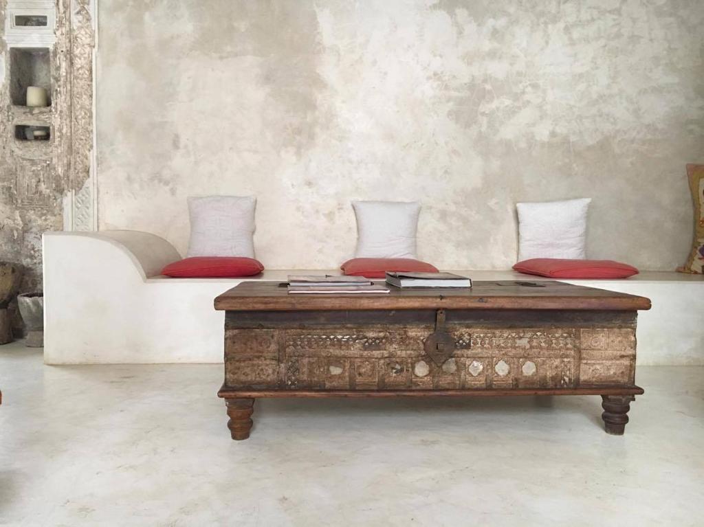 a living room with a coffee table and a couch at Andavelo House in Lamu