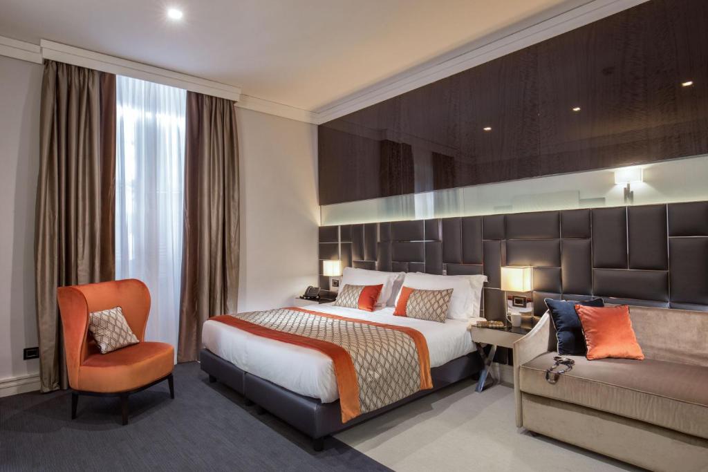 Postel nebo postele na pokoji v ubytování Hotel Gioberti