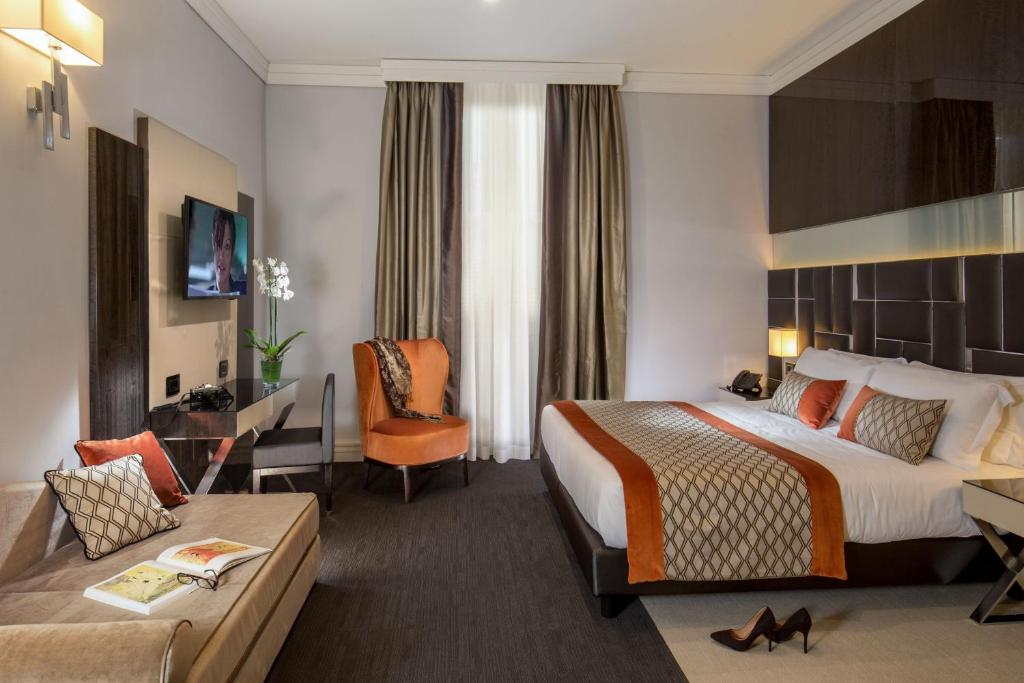 Postel nebo postele na pokoji v ubytování Hotel Gioberti