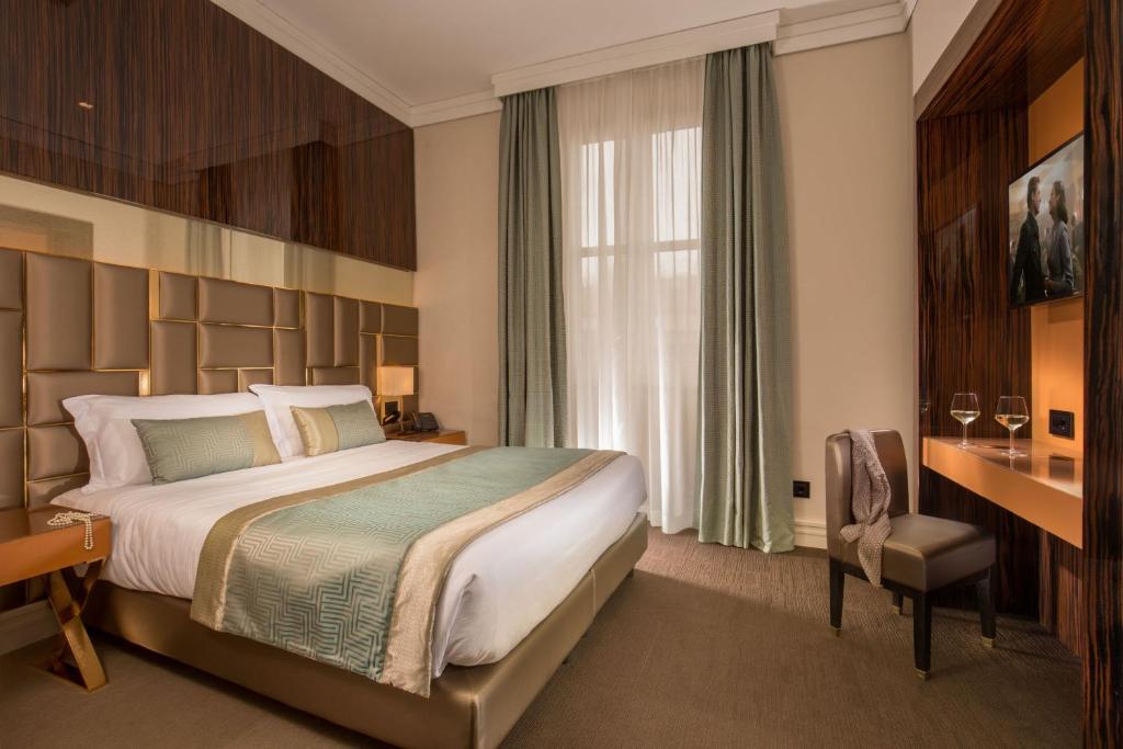 Postel nebo postele na pokoji v ubytování Hotel Gioberti