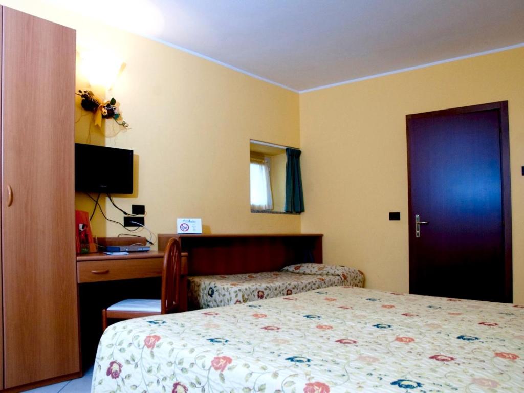 Postel nebo postele na pokoji v ubytování Hotel Agata