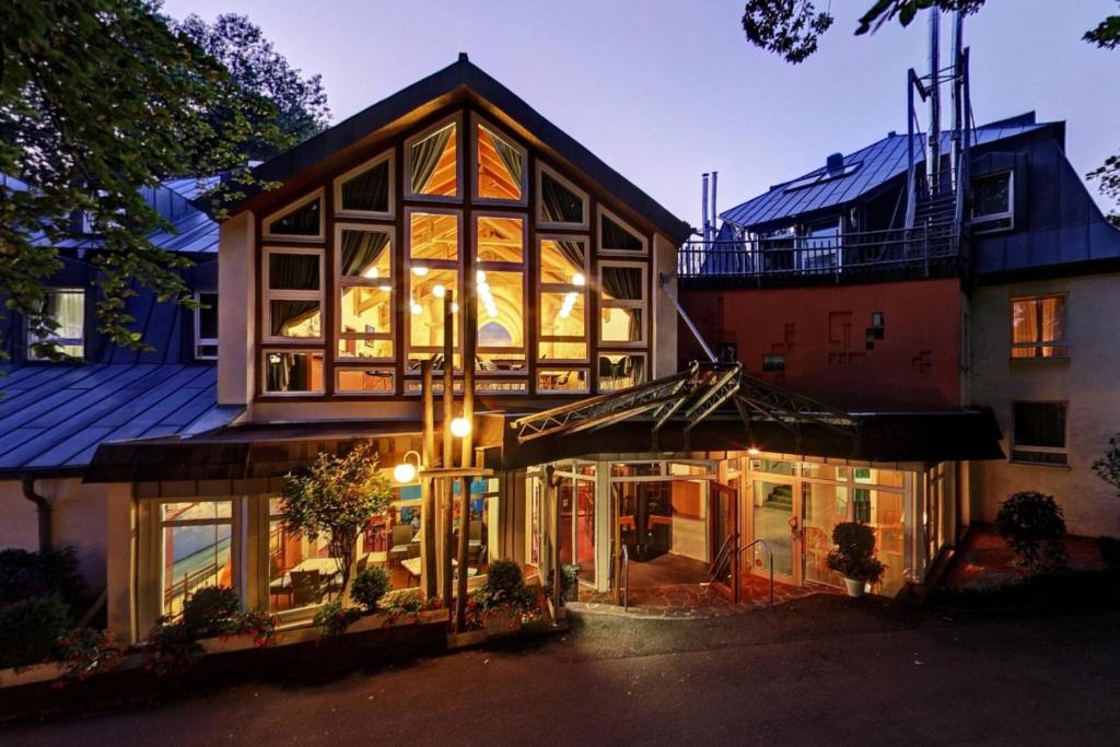 a house with a lot of windows and a building at alfa hotel in Sankt Ingbert