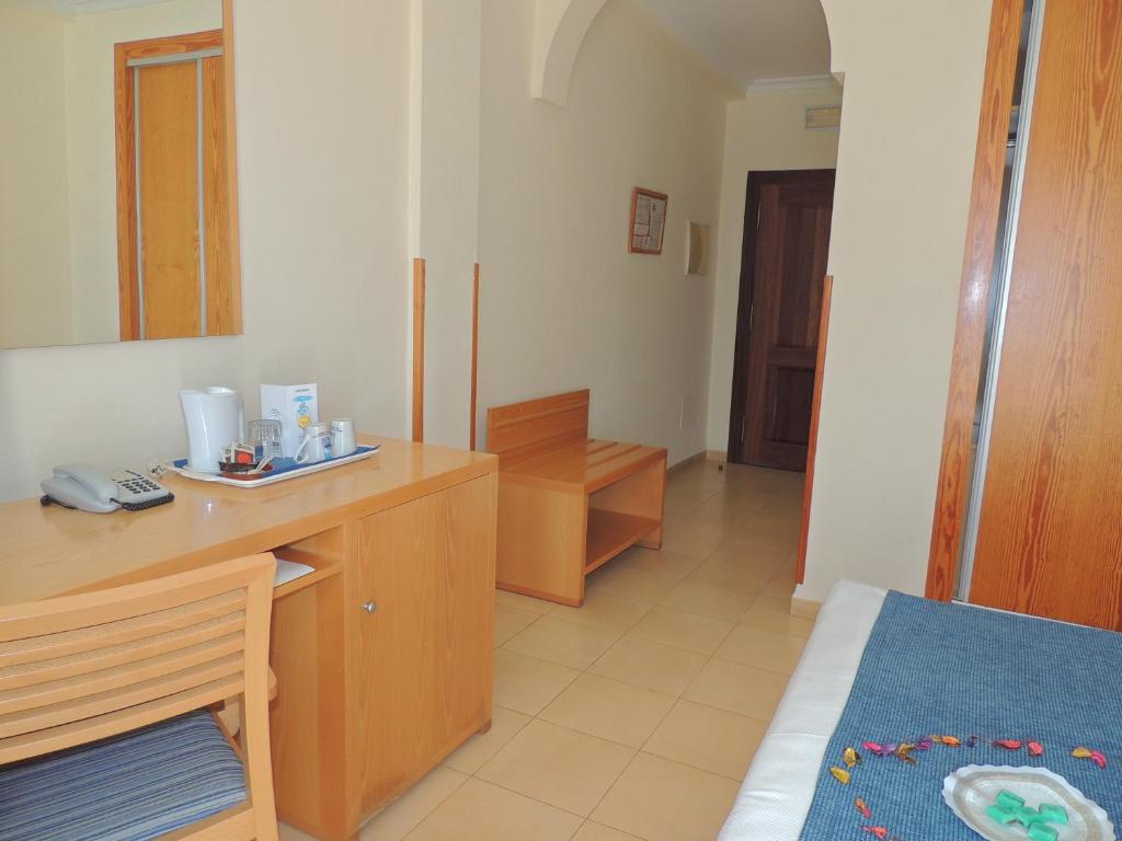Postel nebo postele na pokoji v ubytování Hotel Punta del Cantal