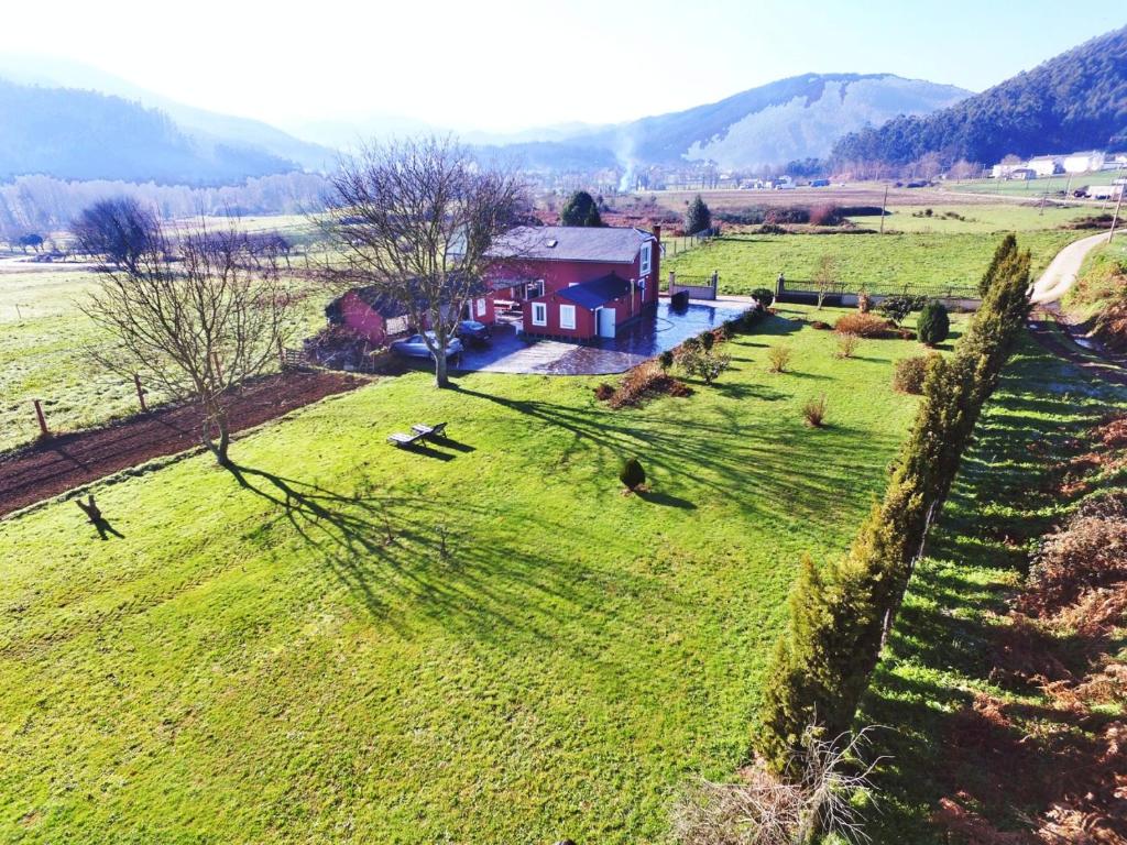 an aerial view of a house in the middle of a field at Casa Encarna Alfoz in Lagoa