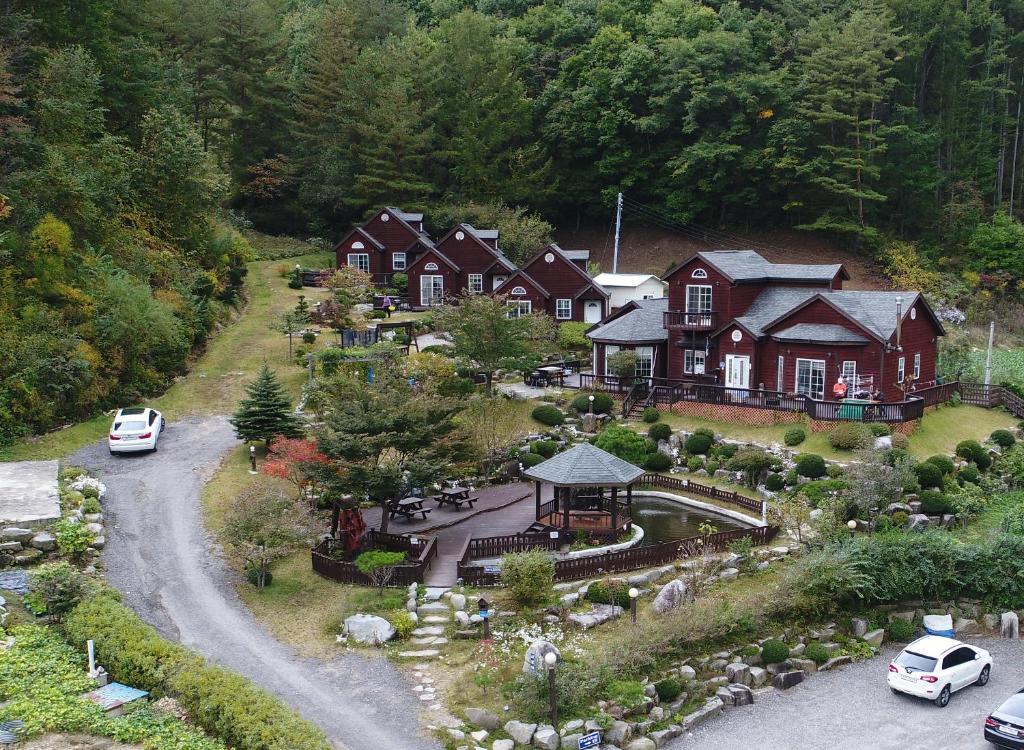 an aerial view of a house with a landscaping at Sisilli Pension in Pyeongchang