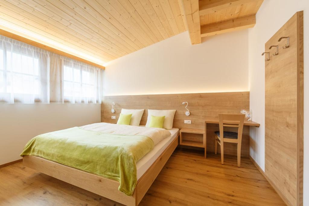 Postel nebo postele na pokoji v ubytování Krebslechnerhof