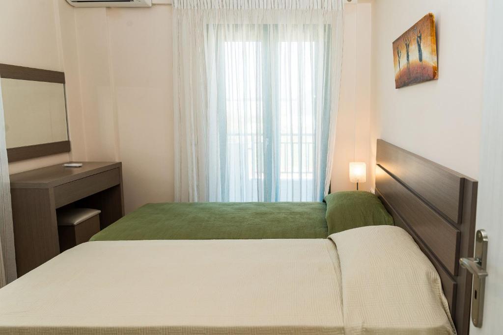 A bed or beds in a room at Villa Kampos