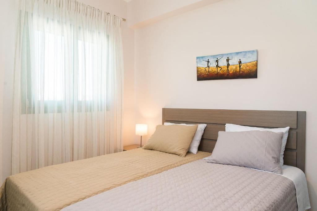 A bed or beds in a room at Villa Kampos