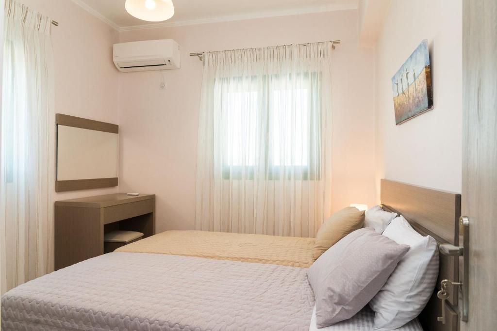 A bed or beds in a room at Villa Kampos