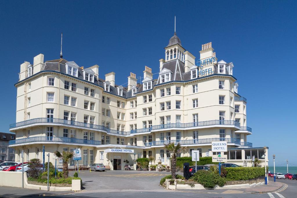 a large white building with a lot of windows at Queens Hotel in Eastbourne