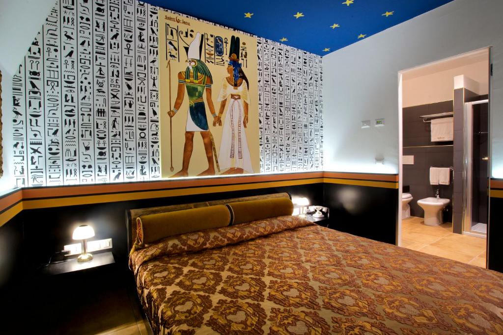 Postel nebo postele na pokoji v ubytování Design Suite Tirano