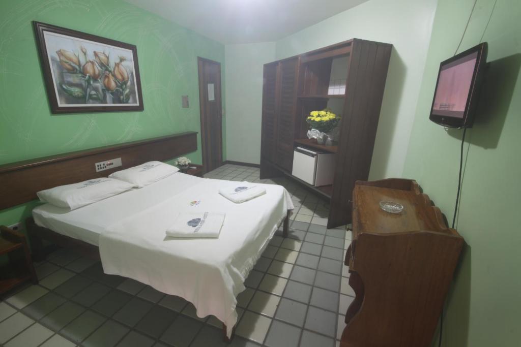 Postel nebo postele na pokoji v ubytování Hotel Terra Mater