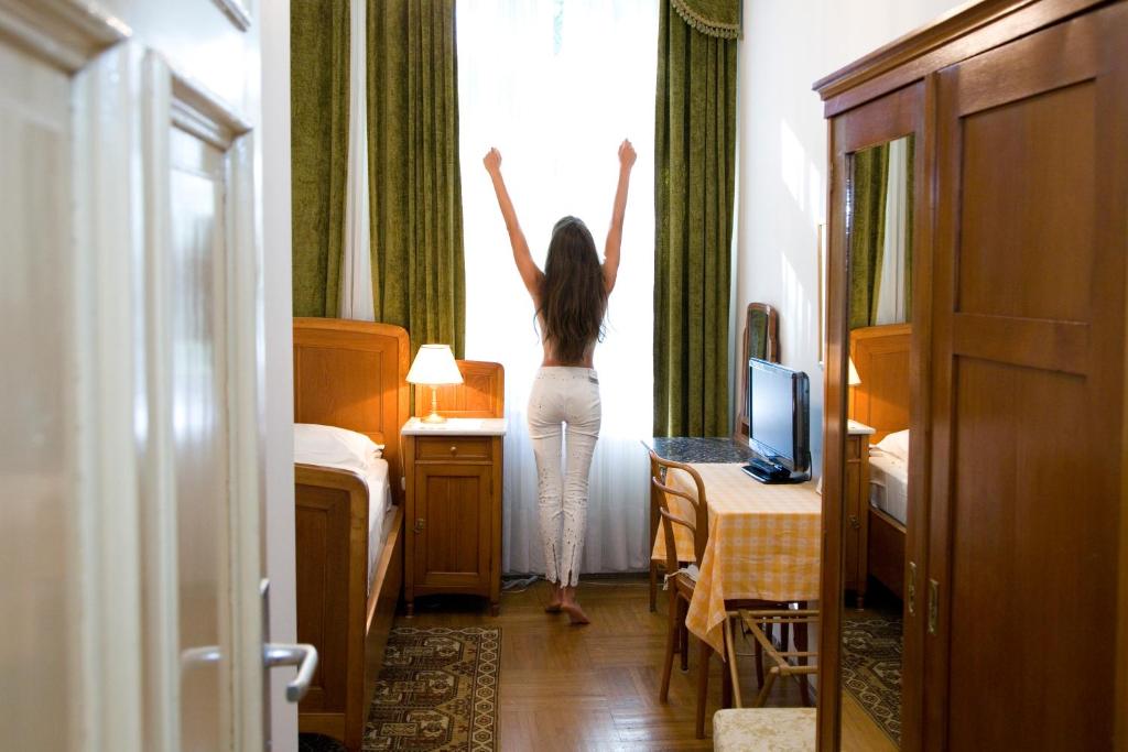 Postel nebo postele na pokoji v ubytování Hotel Villa Westend