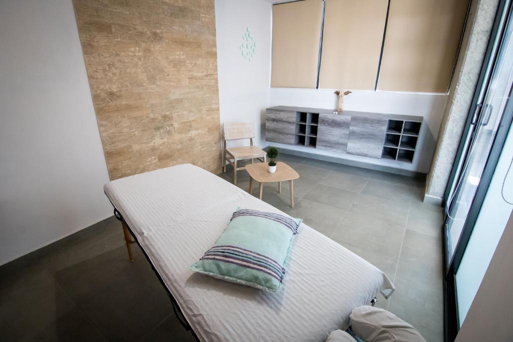Postel nebo postele na pokoji v ubytování Maria Ines Hotel Suite
