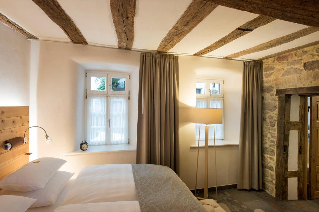 Postel nebo postele na pokoji v ubytování Burggarten Appartements Neuleiningen