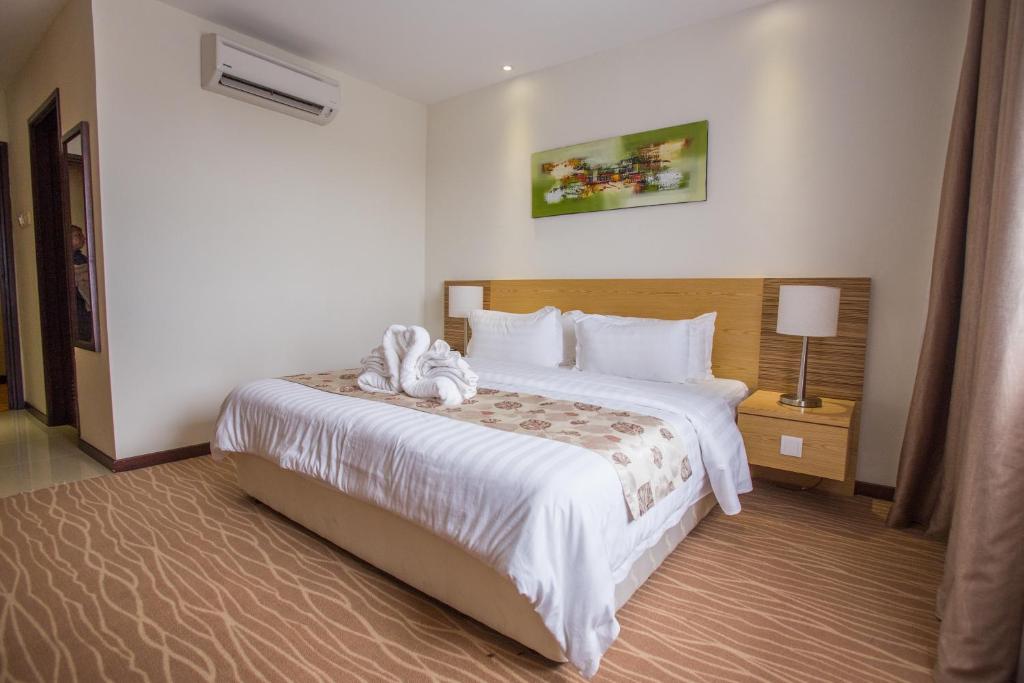 Postel nebo postele na pokoji v ubytování VIP Hotel Segamat