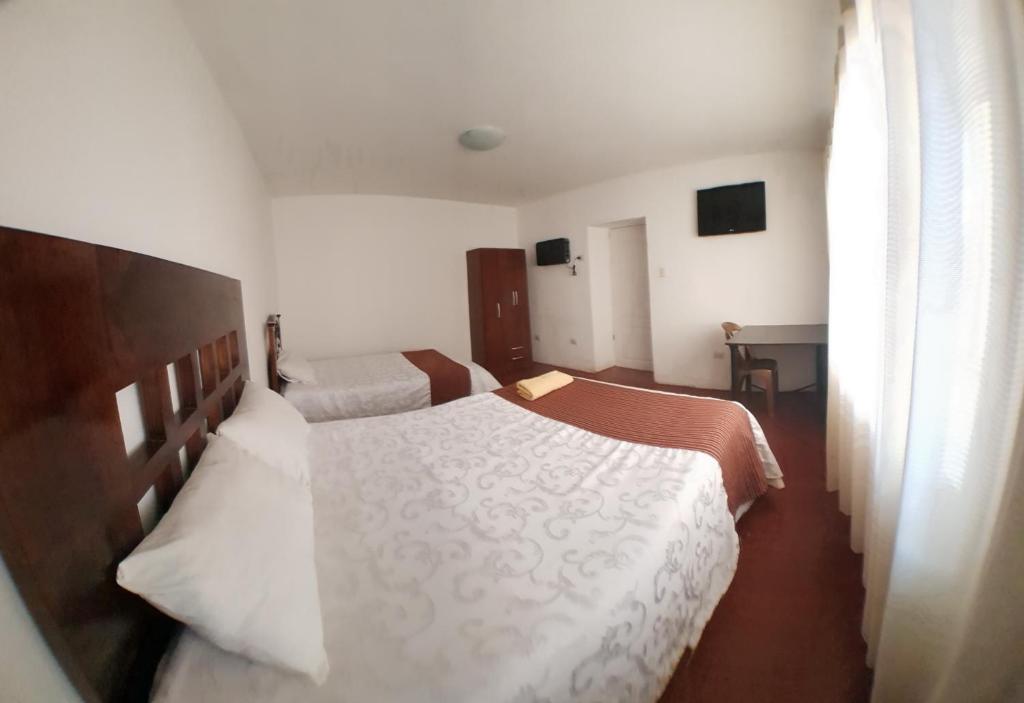 Postel nebo postele na pokoji v ubytování La Cabaña Hotel