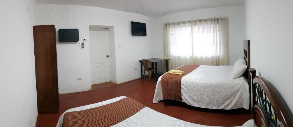 Postel nebo postele na pokoji v ubytování La Cabaña Hotel