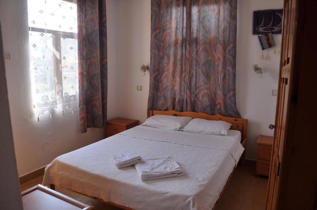 A bed or beds in a room at Jet Pension