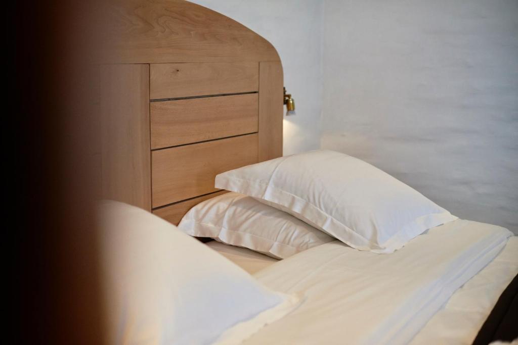 Postel nebo postele na pokoji v ubytování Hotel Colvenier