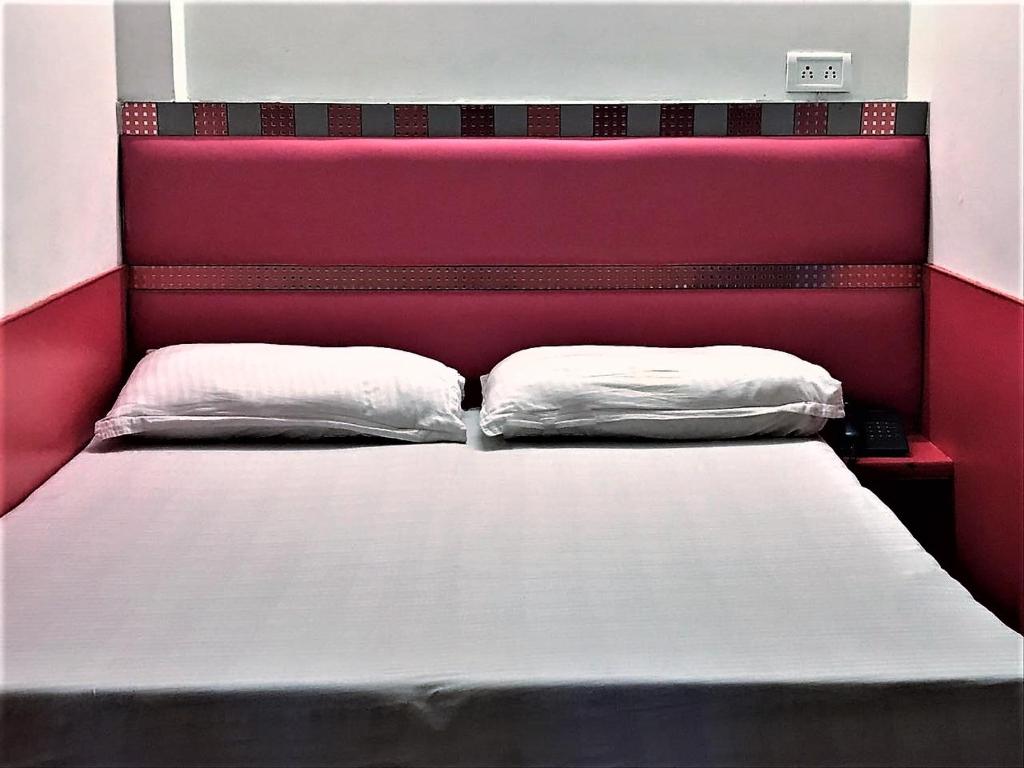 Postel nebo postele na pokoji v ubytování Hotel Kwality