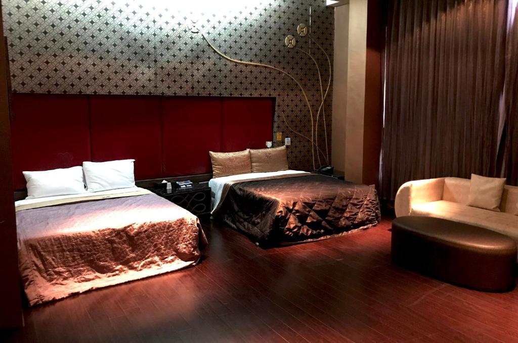 Postel nebo postele na pokoji v ubytování Fortune Villa Motel