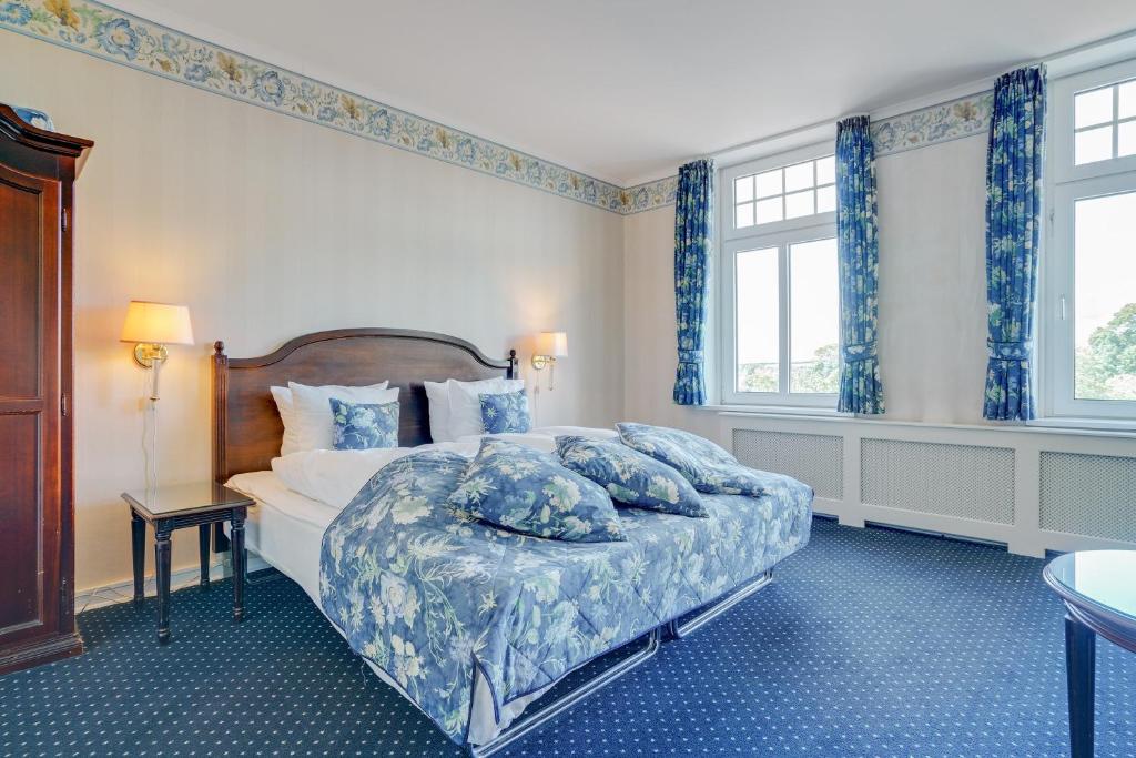 Postel nebo postele na pokoji v ubytování Hotel Sønderborg Garni