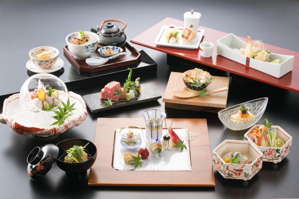 a group of plates of food on a table at Auberge Suzukane in Koriyama