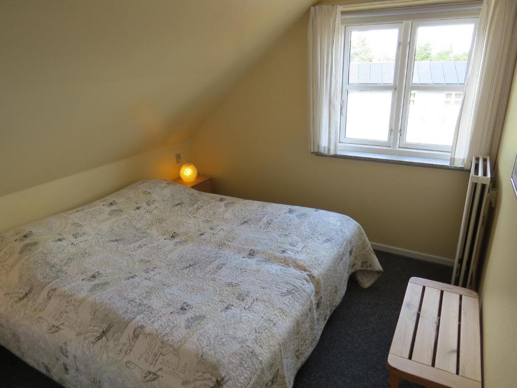 Postel nebo postele na pokoji v ubytování Motel Garni Blåvand