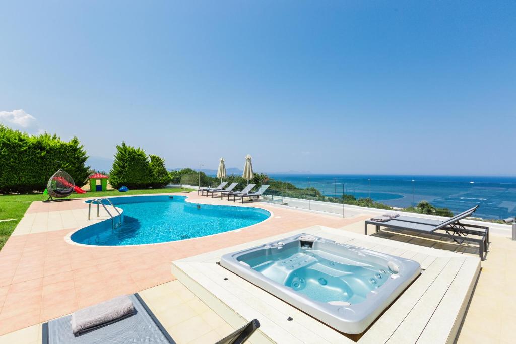 The swimming pool at or close to Kosta Mare Villa, panoramic views, By ThinkVilla