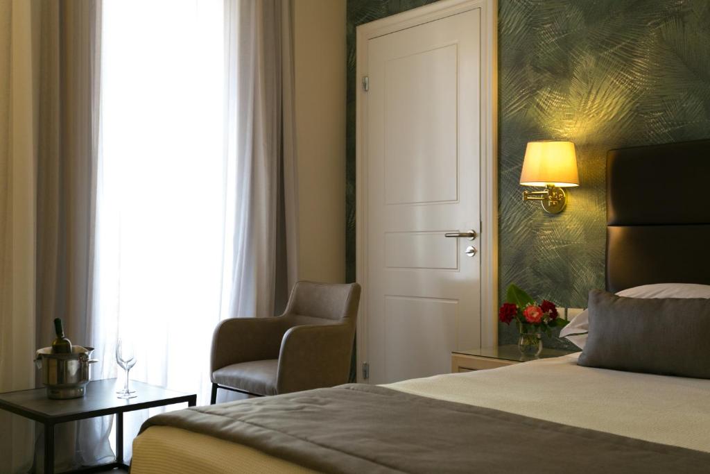 Postel nebo postele na pokoji v ubytování Thermae Sylla Spa & Wellness Hotel