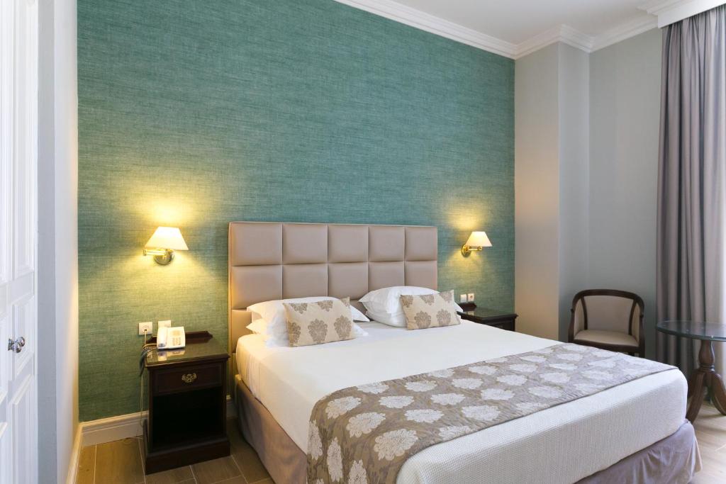 Postel nebo postele na pokoji v ubytování Thermae Sylla Spa & Wellness Hotel