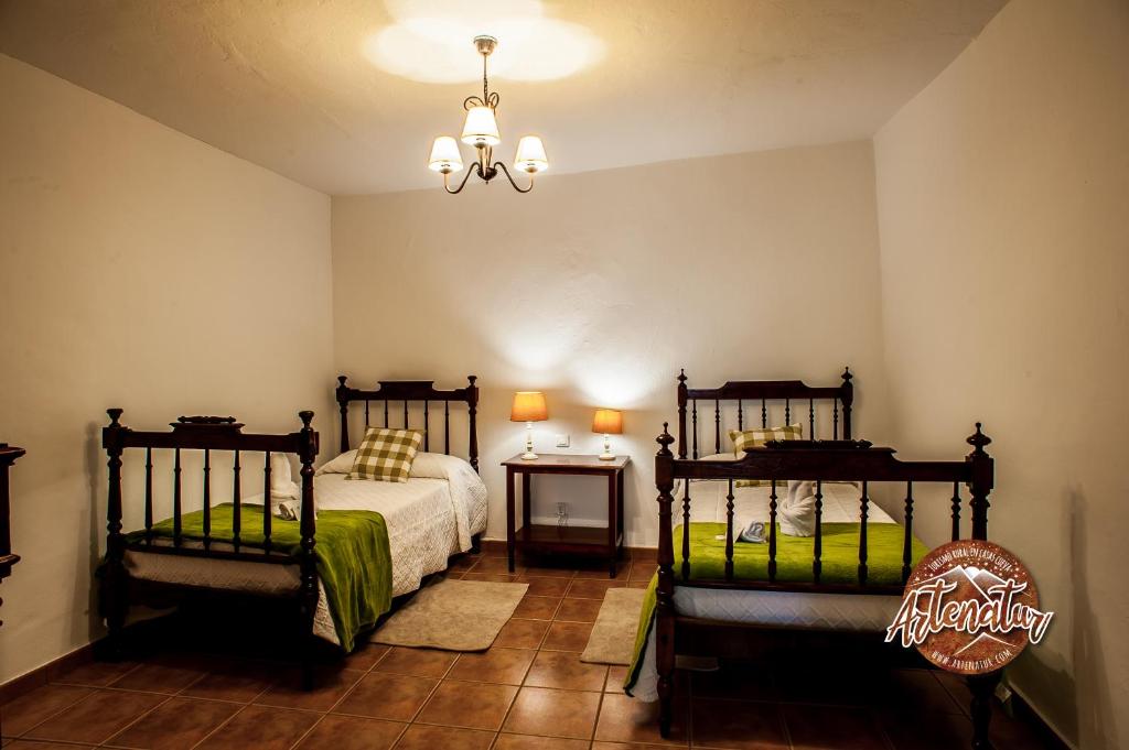 Postel nebo postele na pokoji v ubytování Casa Cueva El Molino