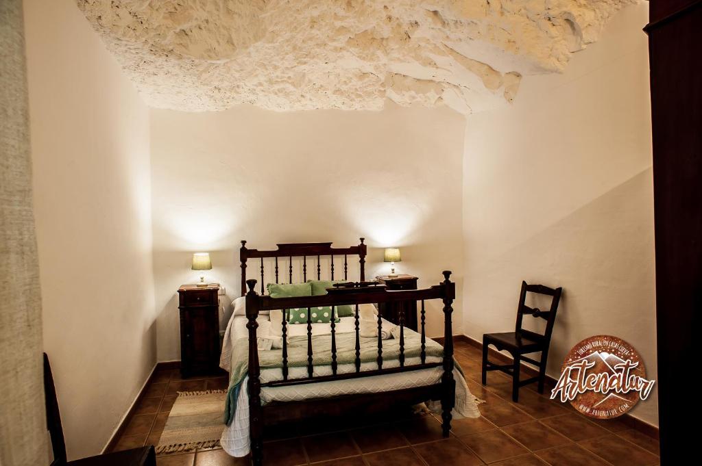 Postel nebo postele na pokoji v ubytování Casa Cueva El Molino