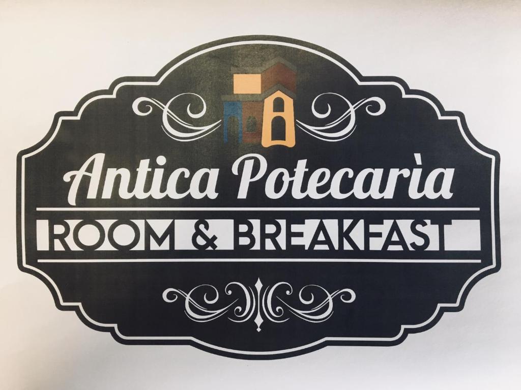 Tonara的住宿－Antica Potecarìa，一间古罗马式早餐室的标志