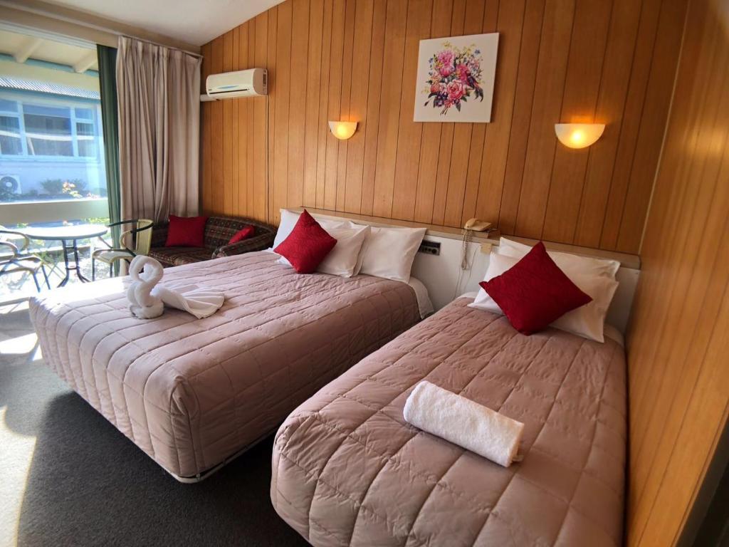 Tui Lodge Motel tesisinde bir odada yatak veya yataklar