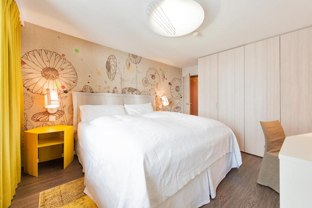Voodi või voodid majutusasutuse Wellness Hotel Stoos toas