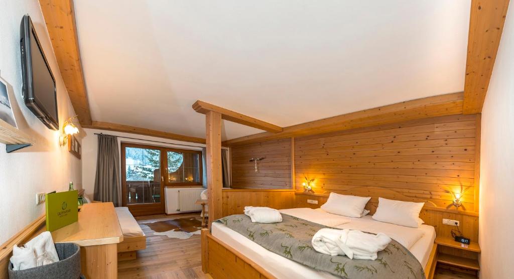 Postel nebo postele na pokoji v ubytování Hotel Frohnatur